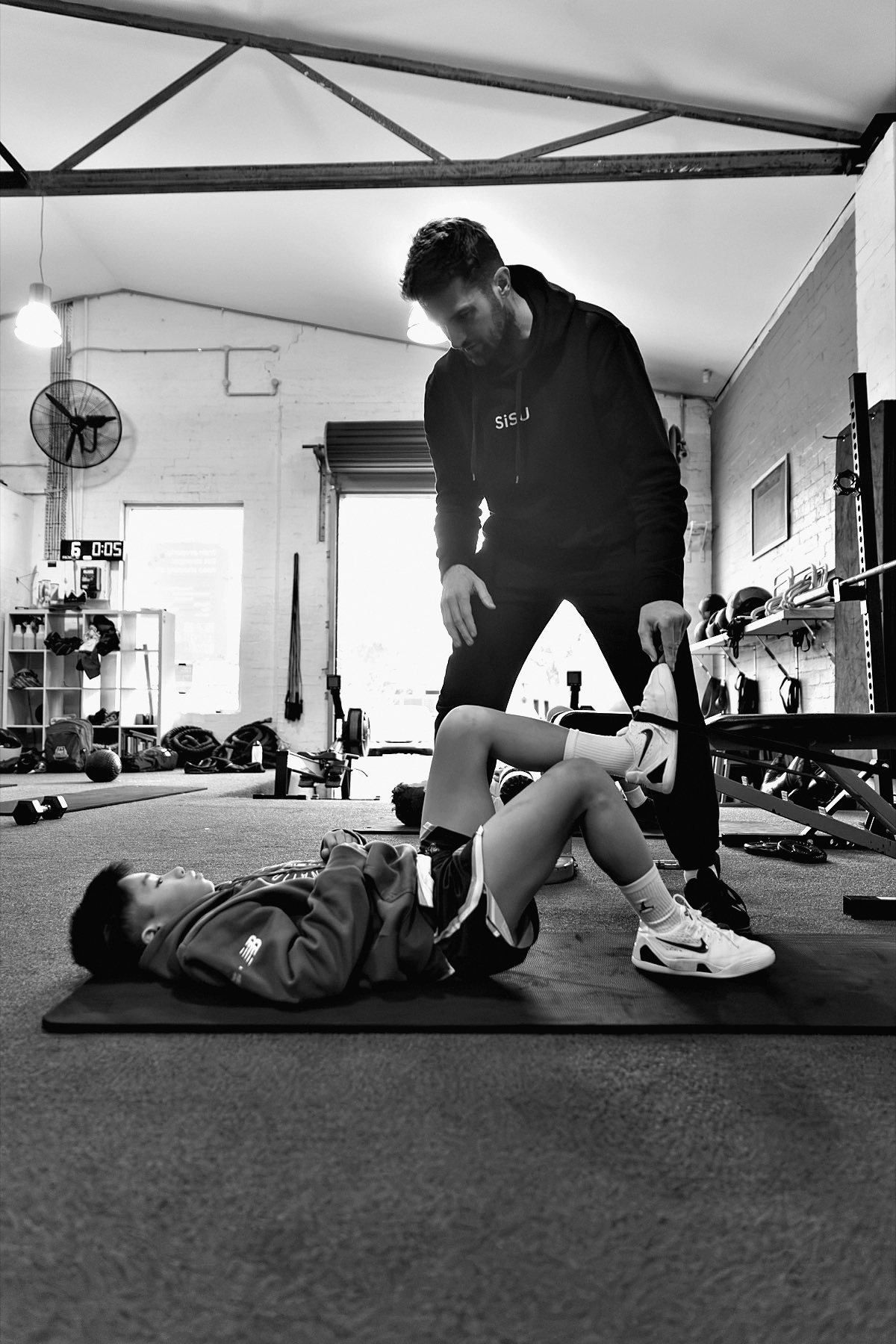 Ben coaching an athlete through a floor exercise